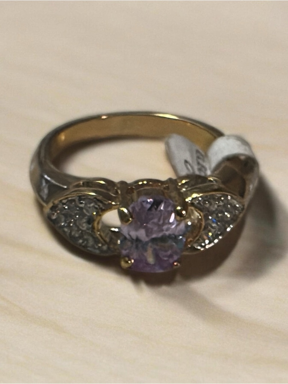14 karat gold, electro plated  beautiful lavender  center cubic zirconia